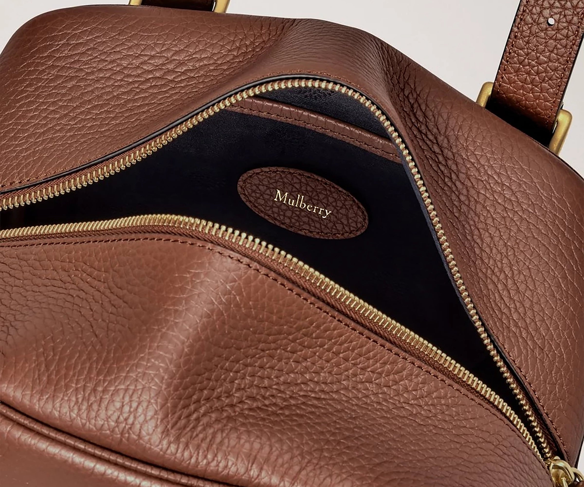 Brown leather bag with gold zipper and Mulberry logo