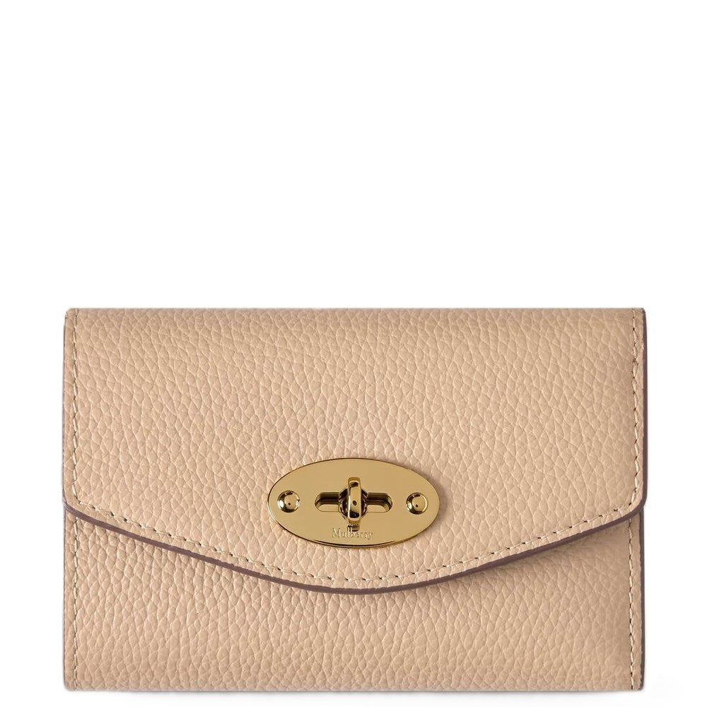 Beige wallet with a gold clasp on a white background