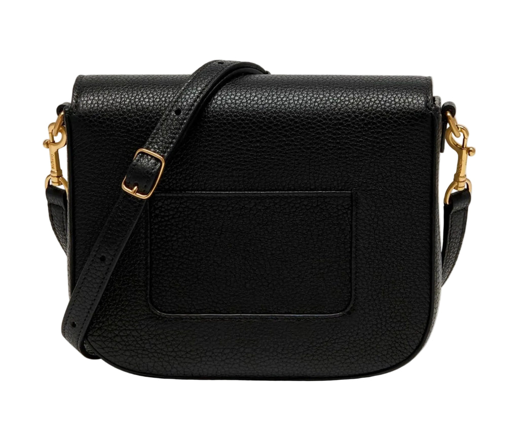 Black leather bag with gold hardware on a light gray background