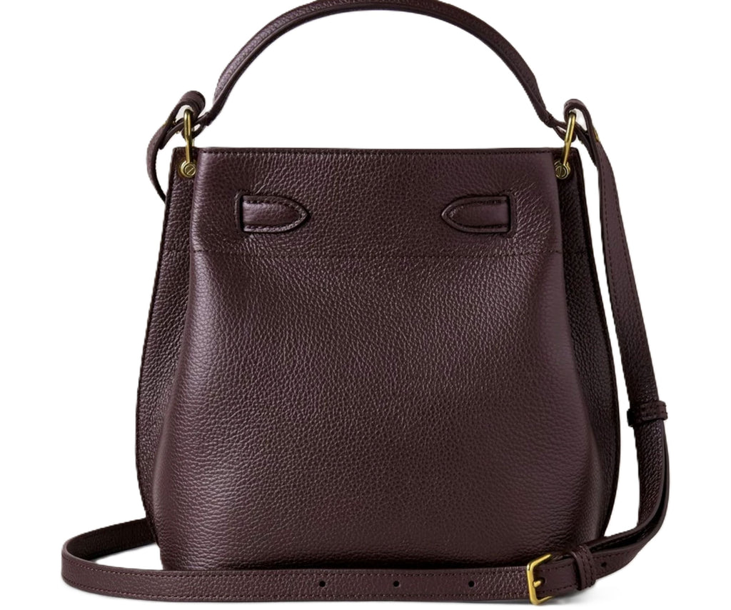 Brown leather handbag with a strap on a white background