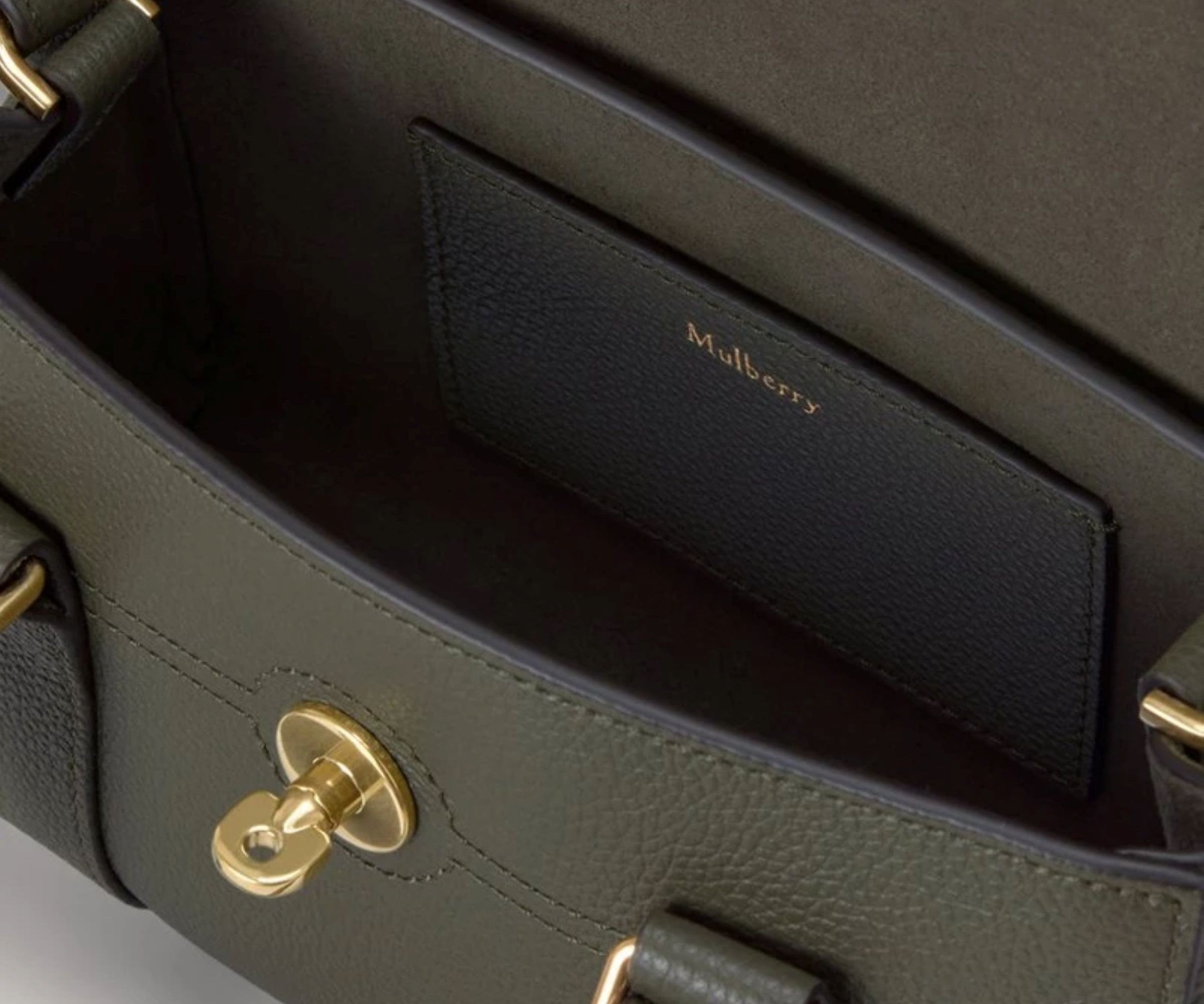 Green Mulberry handbag with gold hardware on a light gray background