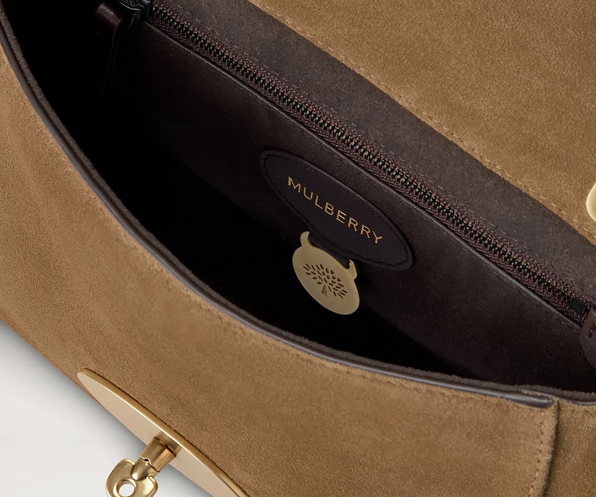 Brown Mulberry handbag with gold clasp on a light gray background
