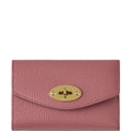 Pink wallet with a gold clasp on a white background
