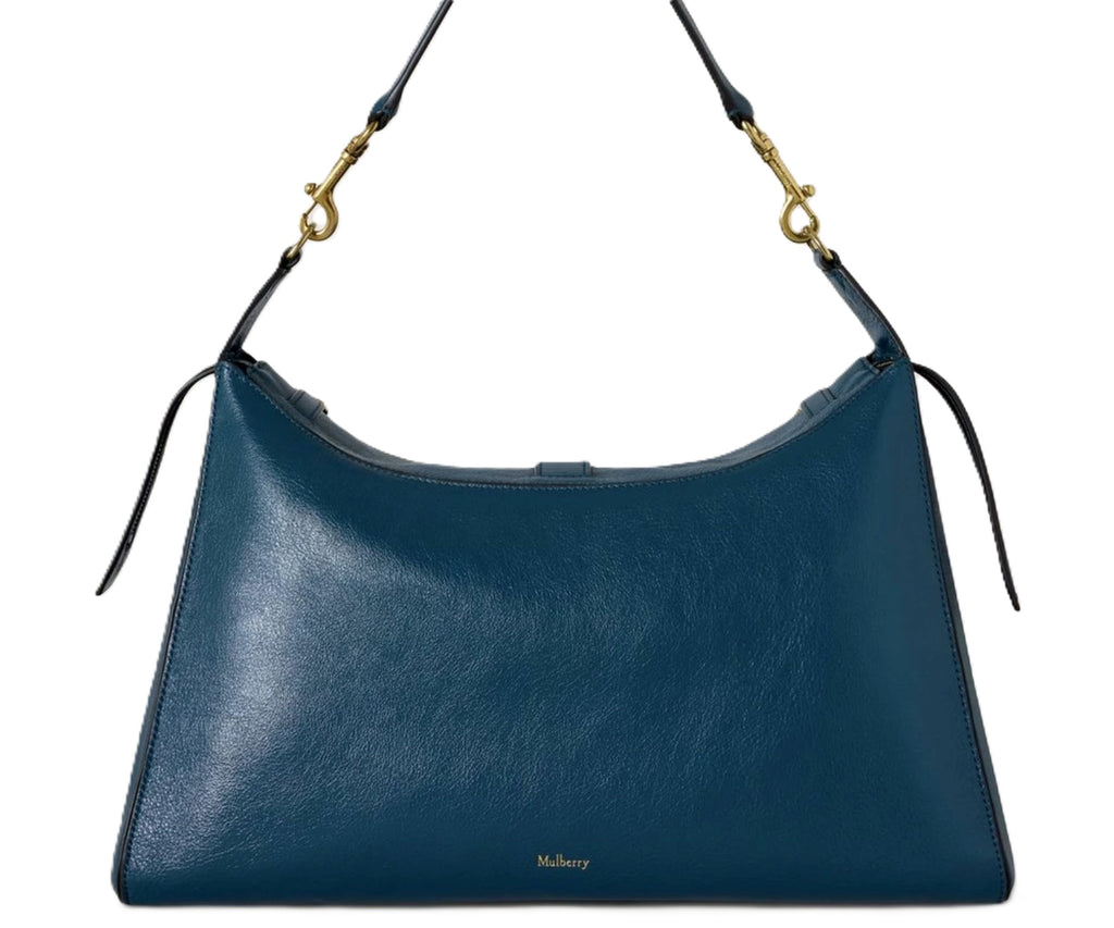 Blue handbag with a gold clasp on a white background