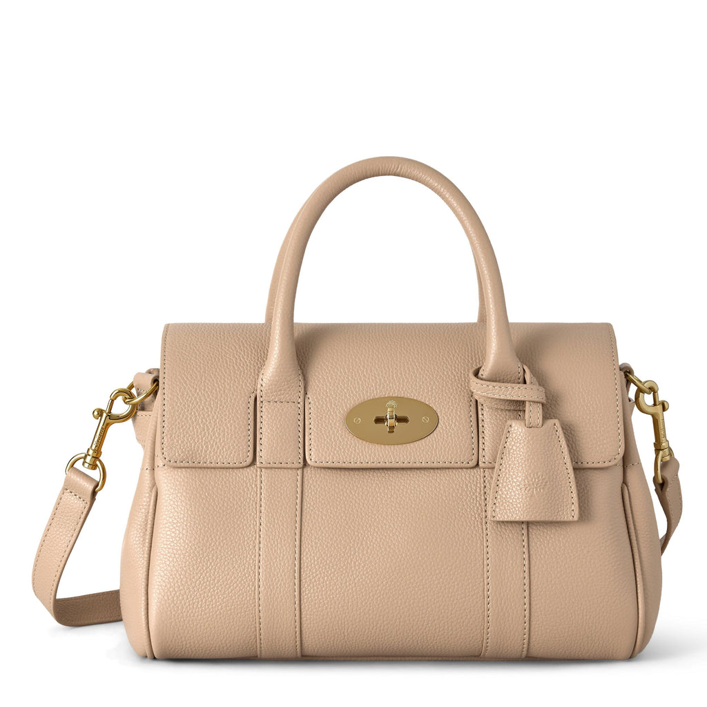 Beige handbag with gold accents on a white background