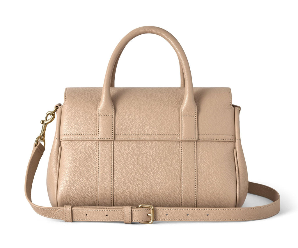 Beige handbag with a strap on a white background