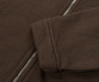 Close-up of a brown jacket with a zipper