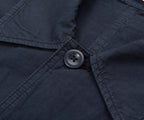 Close-up of a button on a navy blue fabric