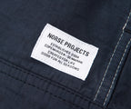 Norse Projects label on a dark fabric background