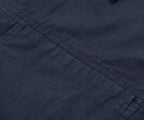 Close-up of dark blue fabric with visible stitching