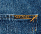 Nudie Jeans label on a blue denim fabric