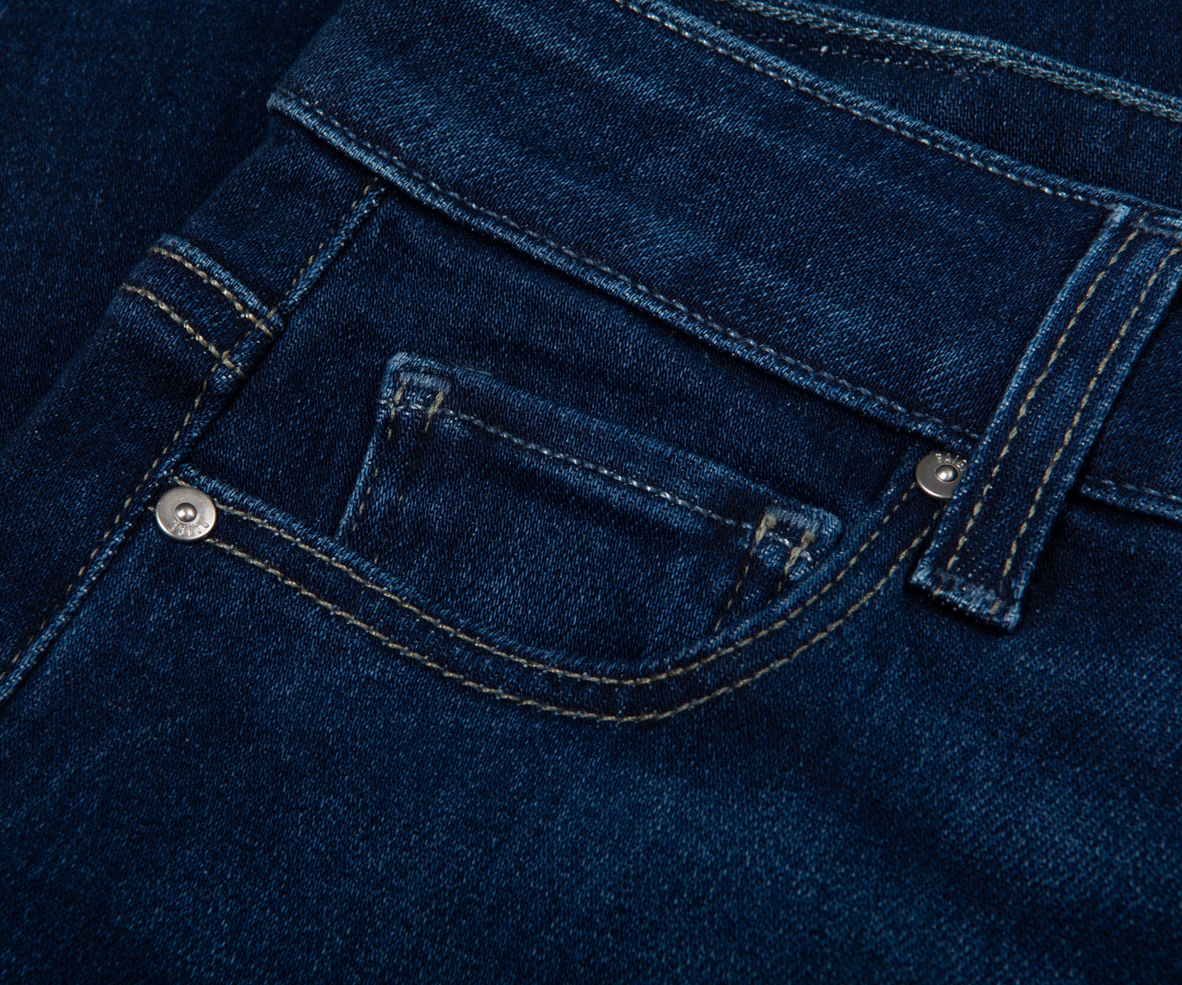 Close-up of a blue denim pocket with stitching details