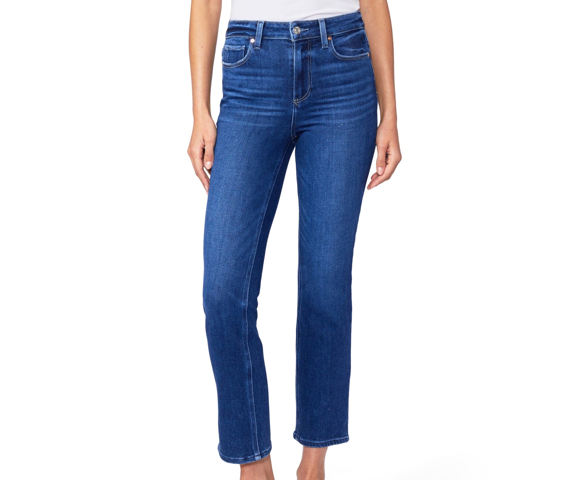 Blue jeans worn by a person on a white background