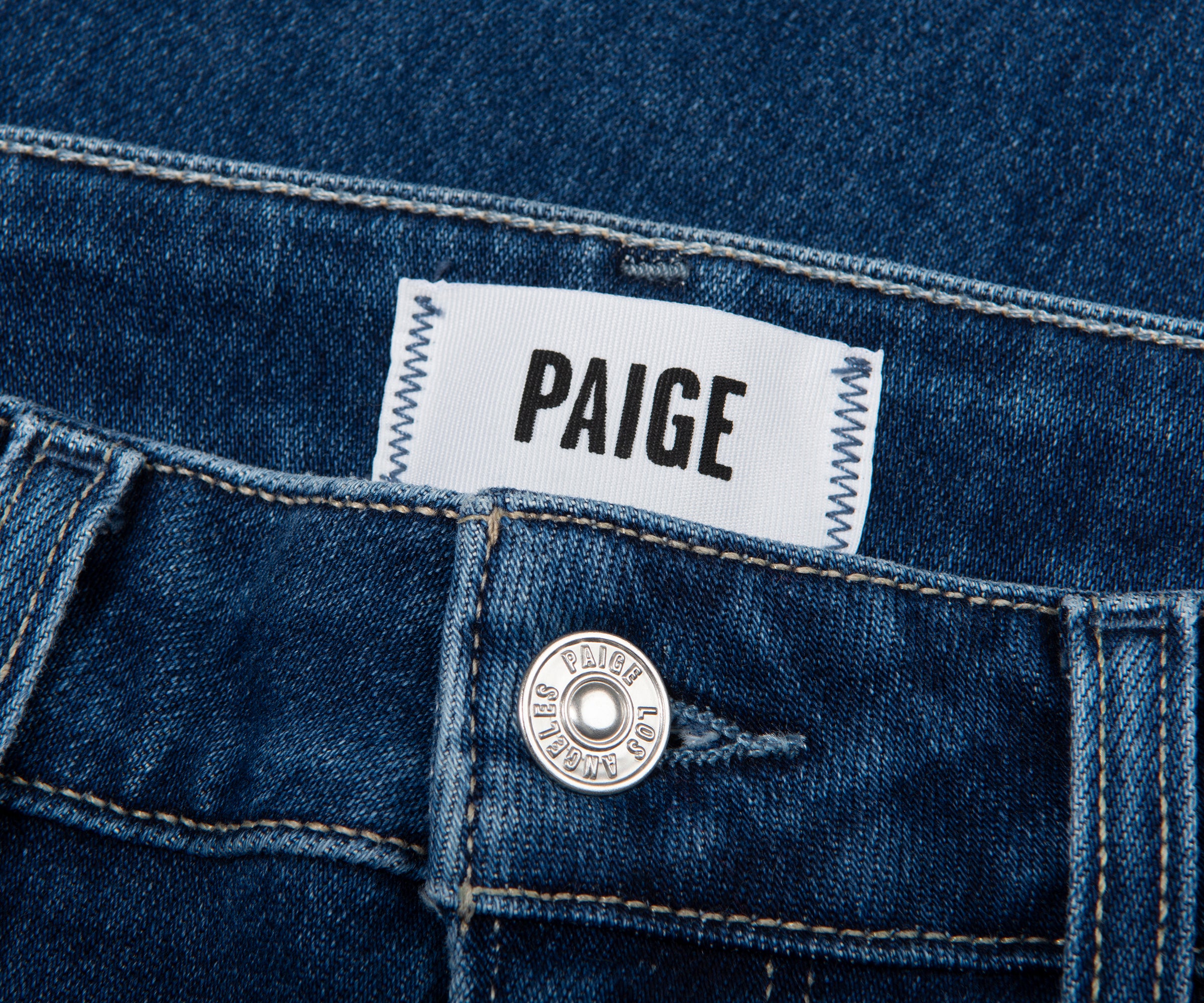 Paige denim label on a blue denim fabric
