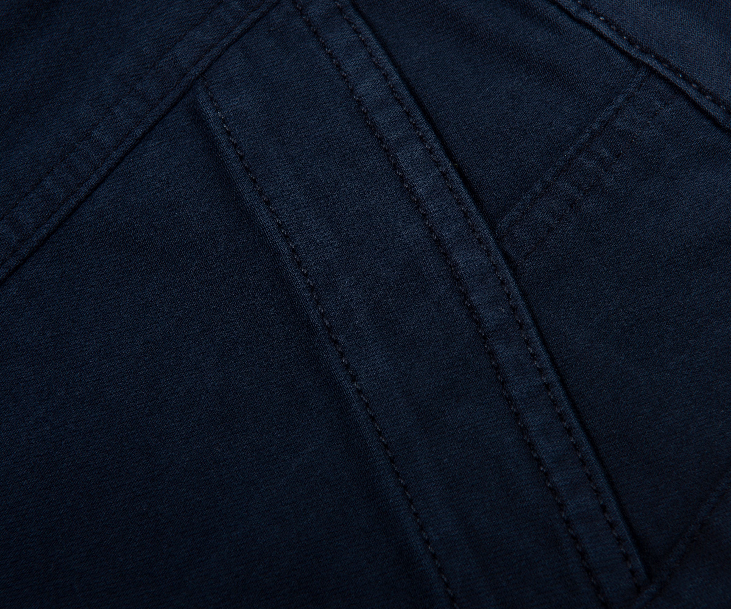 Close-up of dark blue fabric with stitching detail
