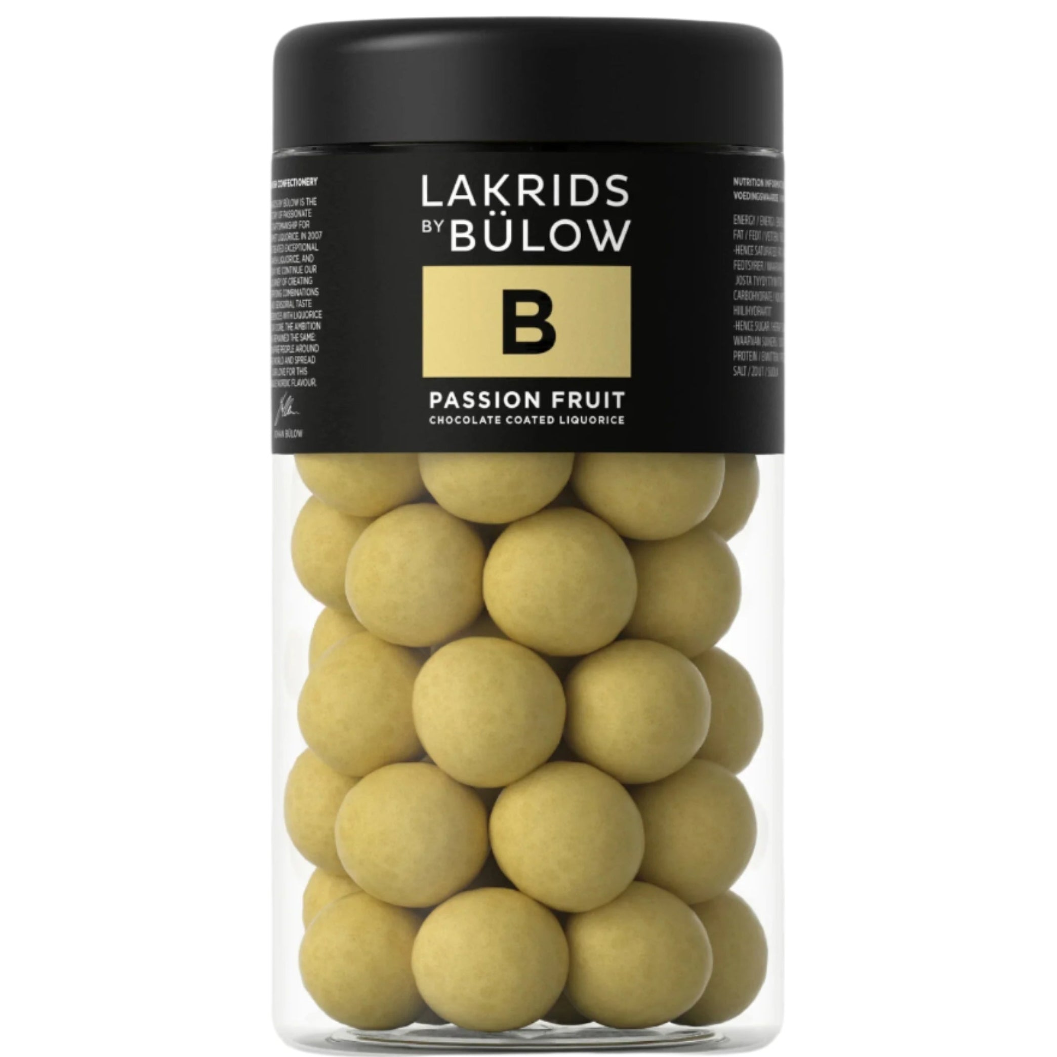 A cylindrical container filled with yellow spherical candies, with a black lid and a label that reads 'LAKRIDS BY BULOW B PASSION FRUIT 295G'.