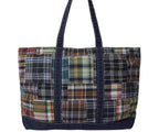 Plaid patterned tote bag with navy accents on a light gray background