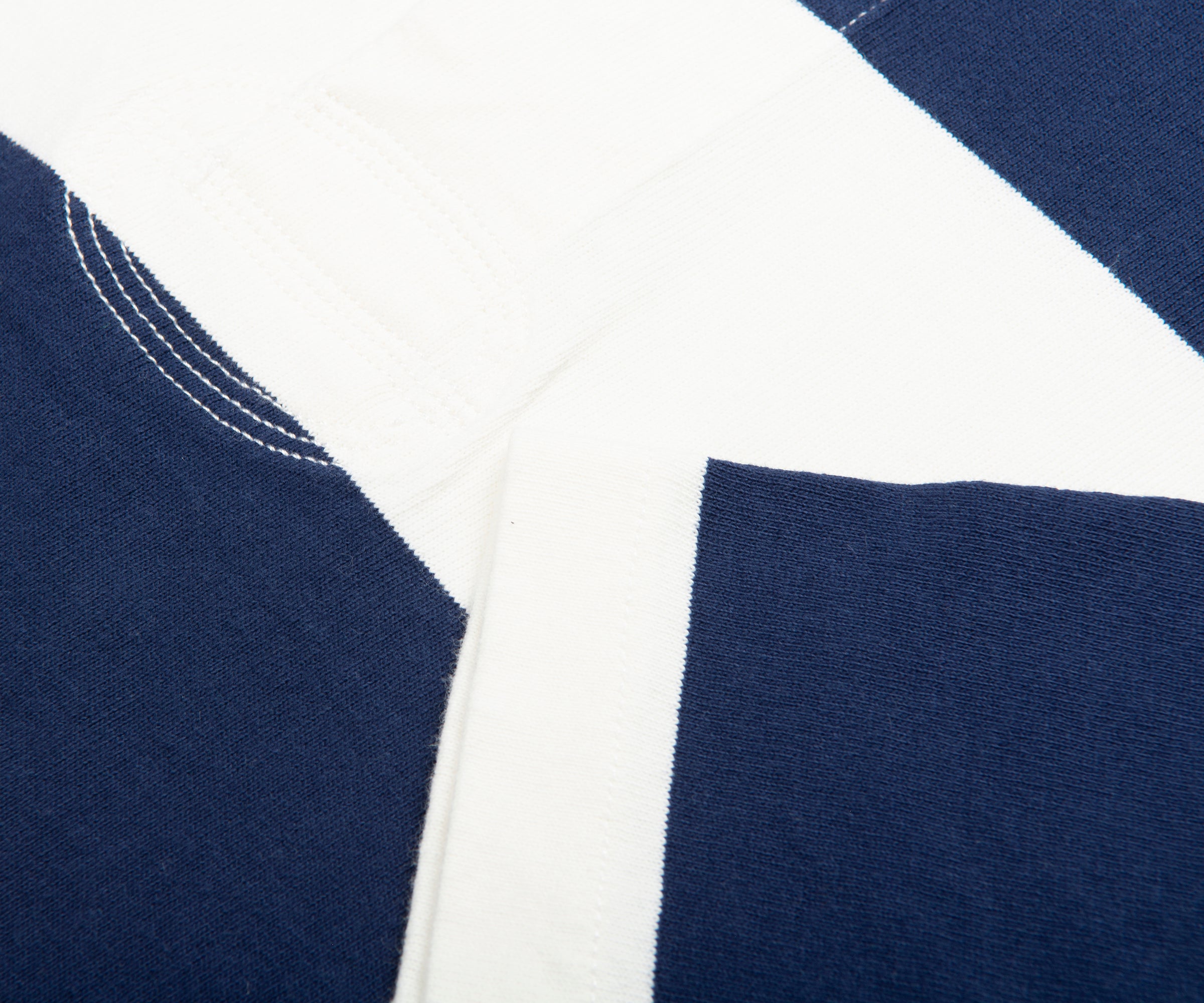 Close-up of navy and white fabric with stitching detail
