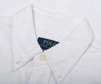 Close-up of a white shirt with a Polo Ralph Lauren label on a white background