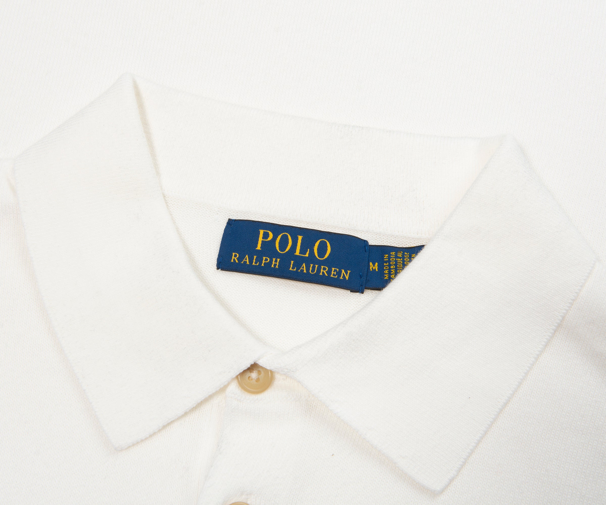 Close-up of a Polo Ralph Lauren shirt with a visible label on a white background