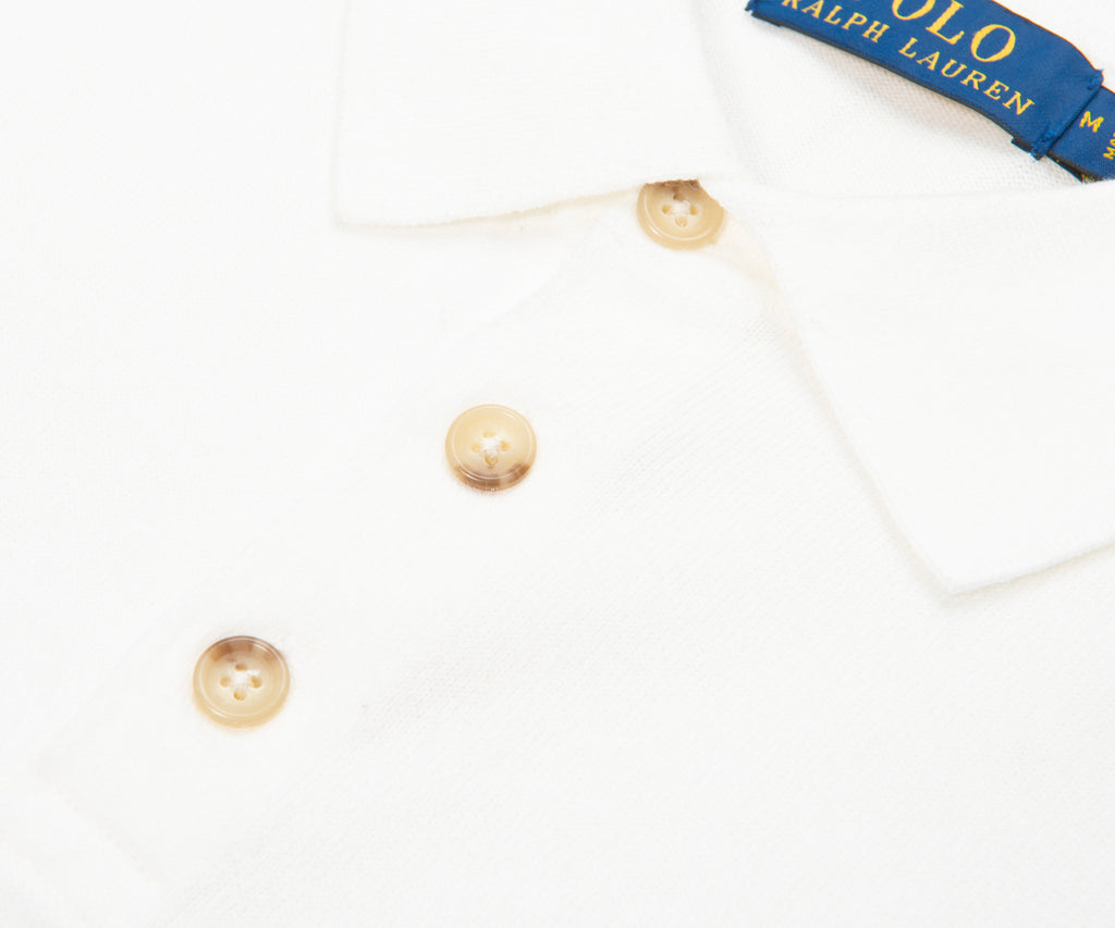 Pearl earrings on a white background with Ralph Lauren box.