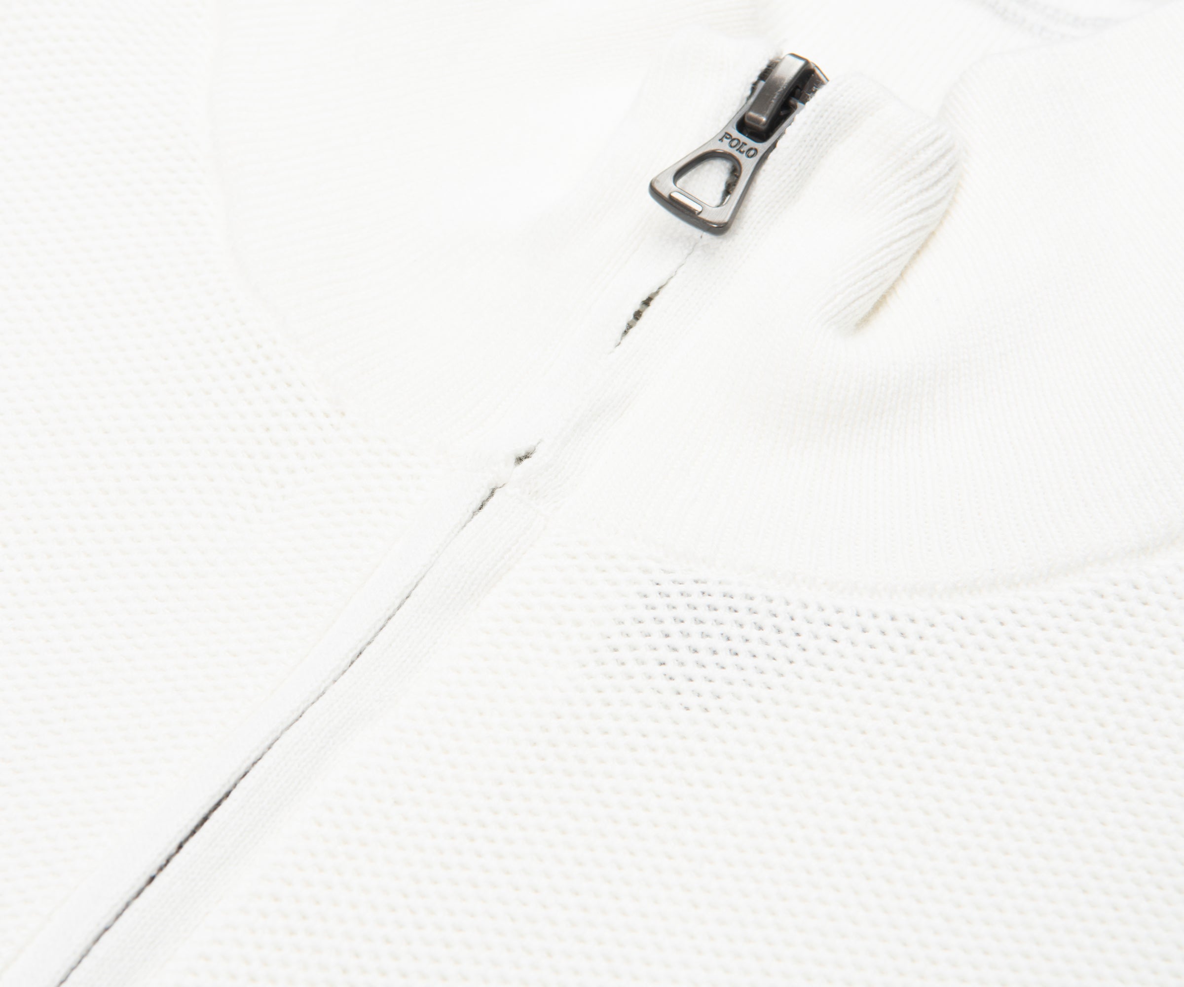 Close-up of a zipper on a white background