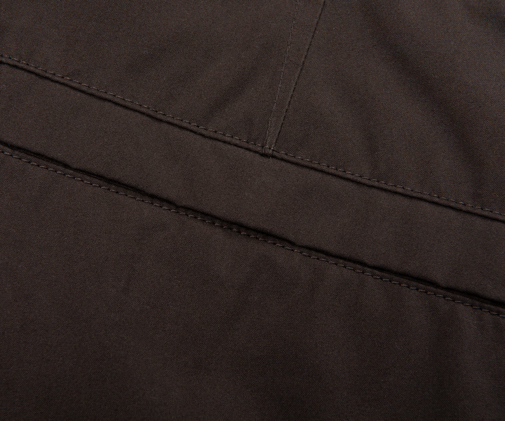 Close-up of a dark brown fabric texture