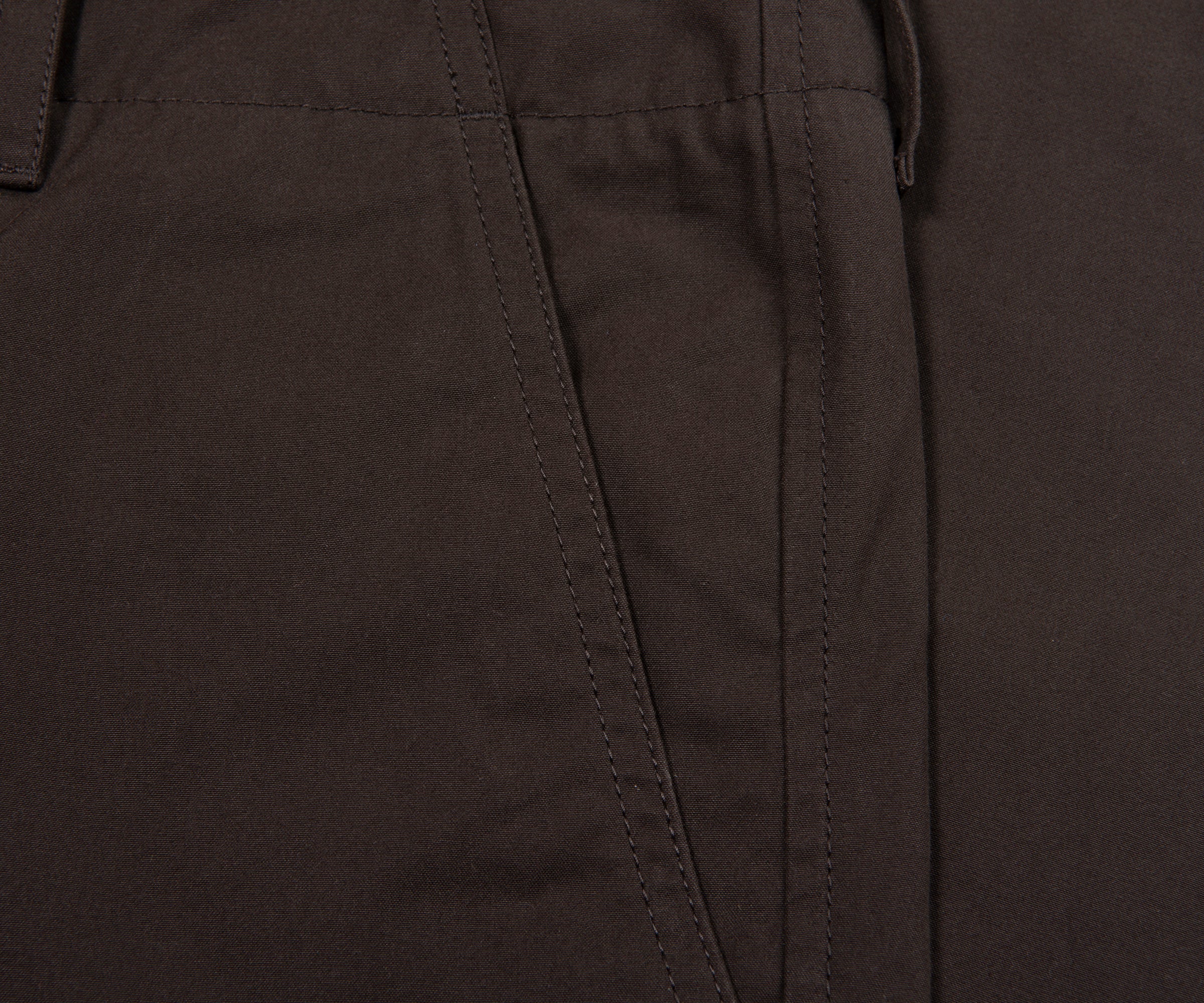Close-up of dark brown pants with a focus on texture and stitching.