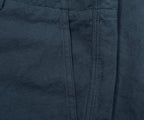 Close-up of dark blue fabric with a visible seam