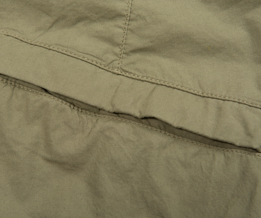 Close-up of a green fabric with stitching detail