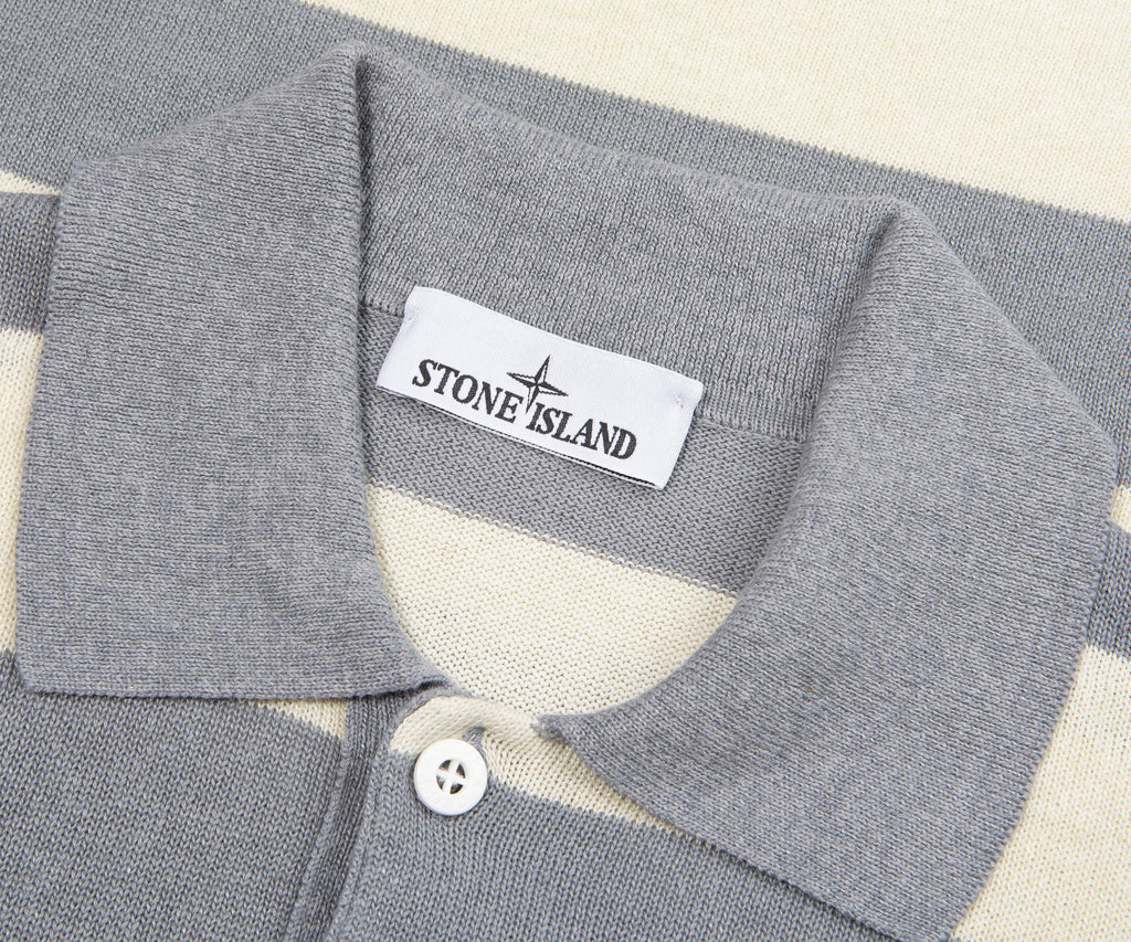 Close-up of a gray polo shirt collar with Stone Island label