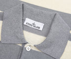 Close-up of a gray polo shirt collar with Stone Island label