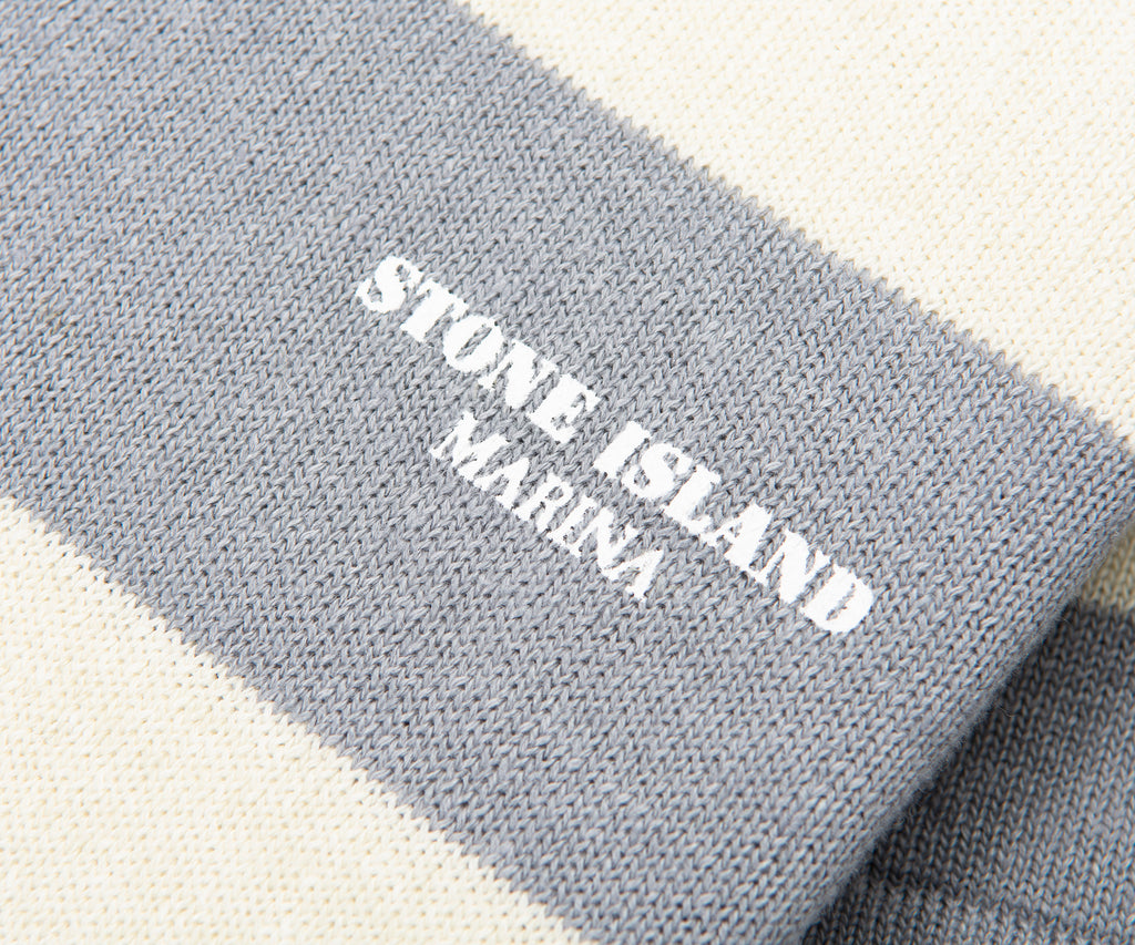 Gray fabric with 'Stone Island Marina' logo on a white background