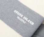 Gray fabric with 'Stone Island Marina' logo on a white background