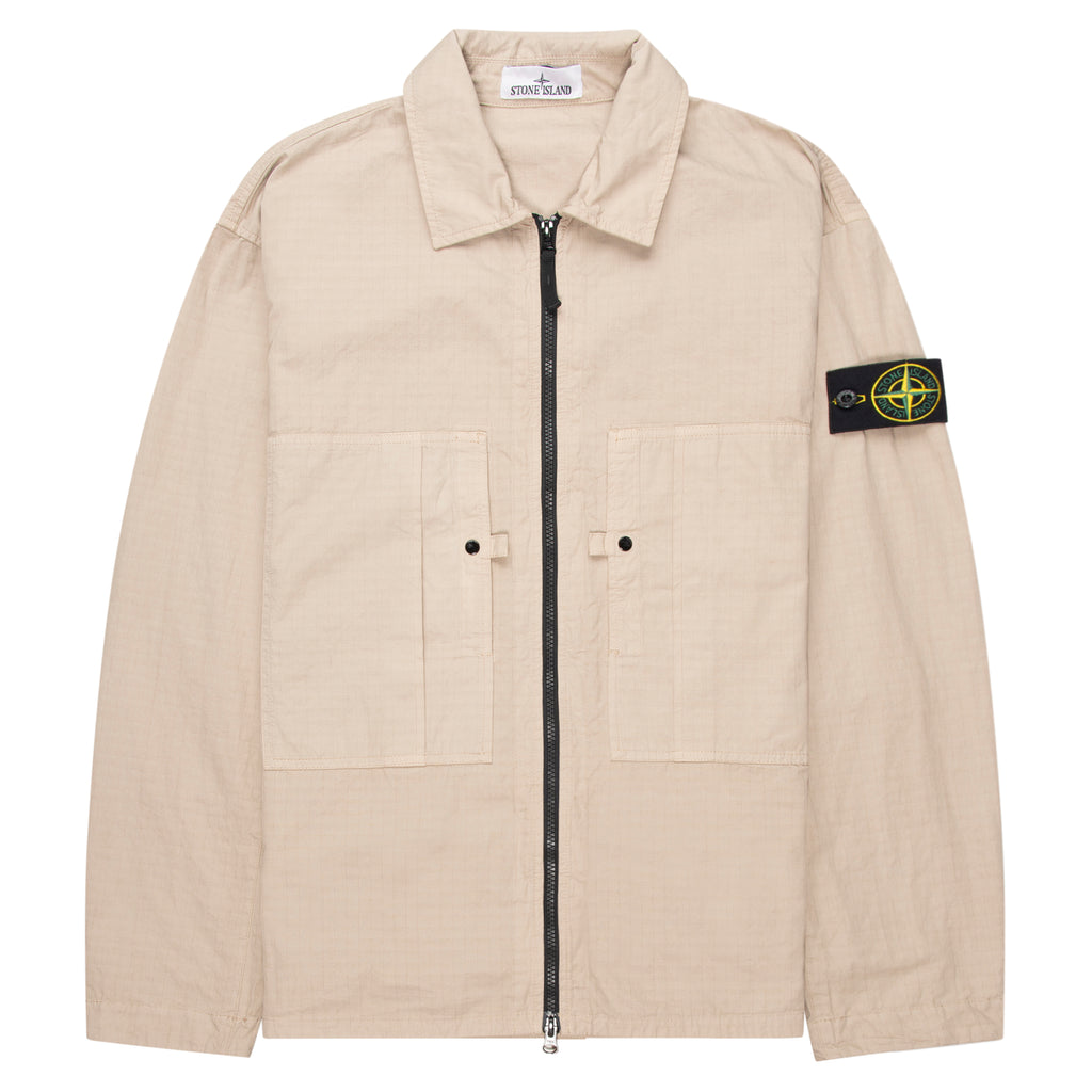 Beige jacket with a brand logo on the sleeve against a white background