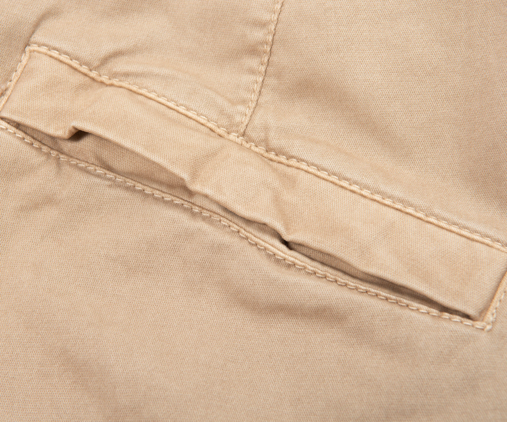 Close-up of beige fabric with stitching detail