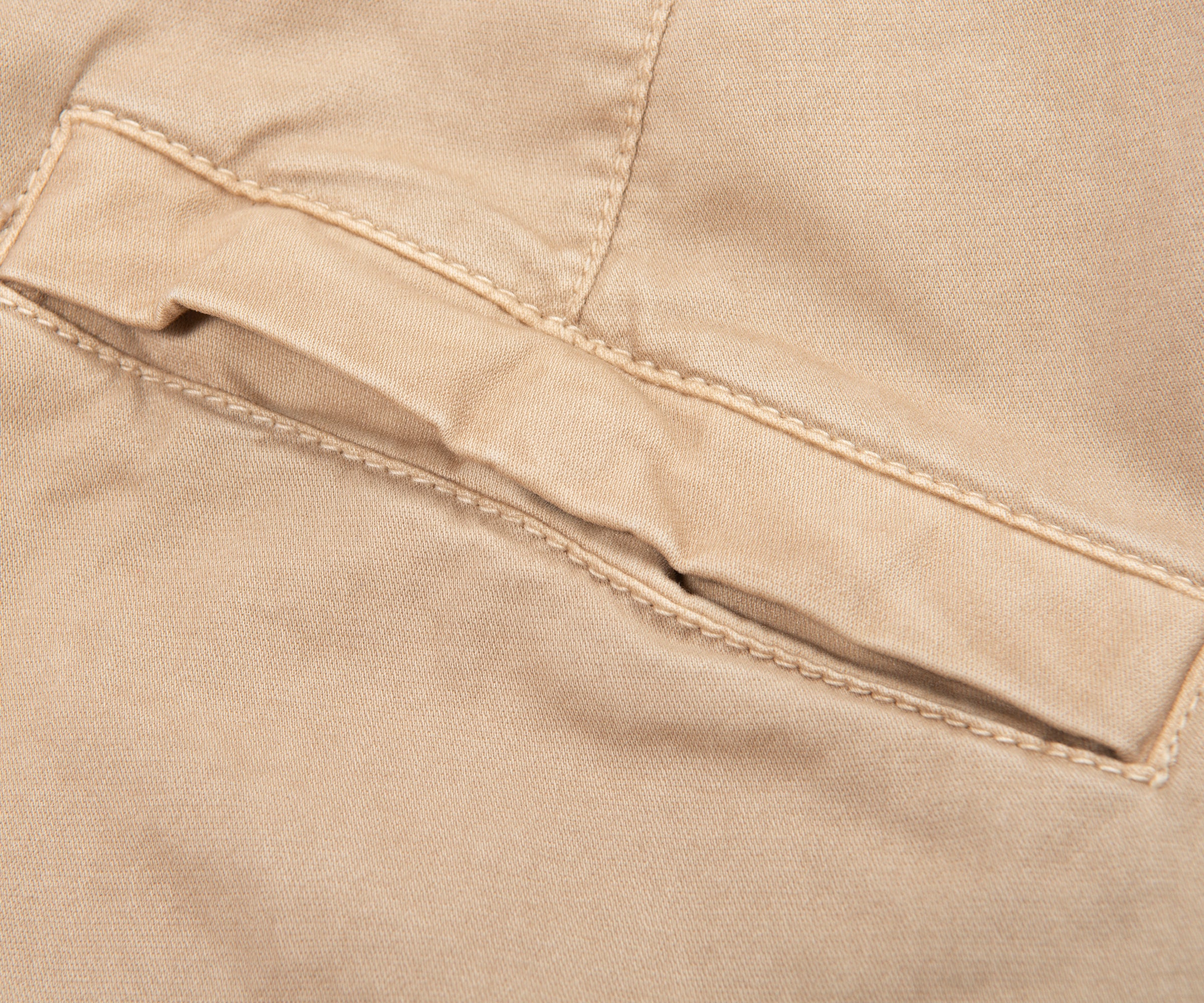 Close-up of beige fabric with stitching detail