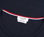 Navy shirt with a visible label on a dark background