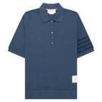 Blue polo shirt with striped sleeves on a white background