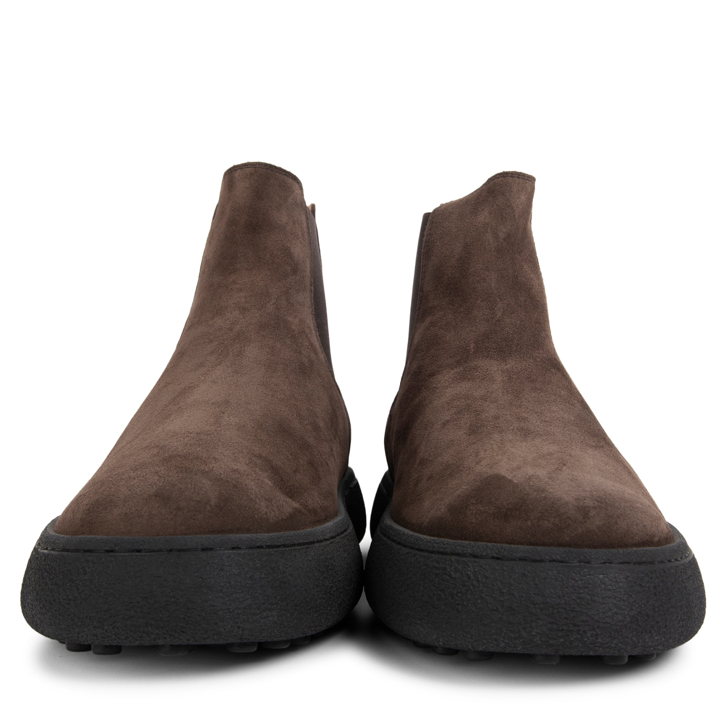 Pair of brown suede ankle boots on a white background