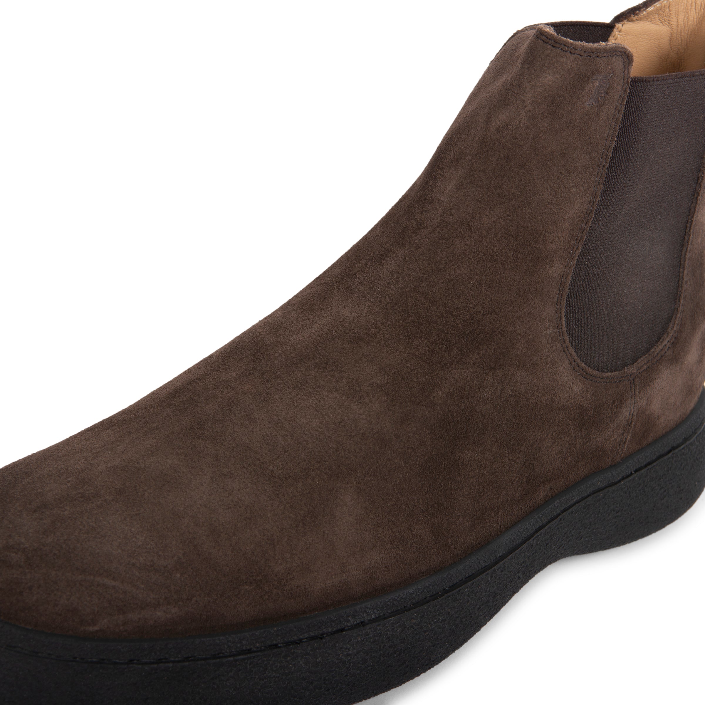 Brown suede shoe on a white background