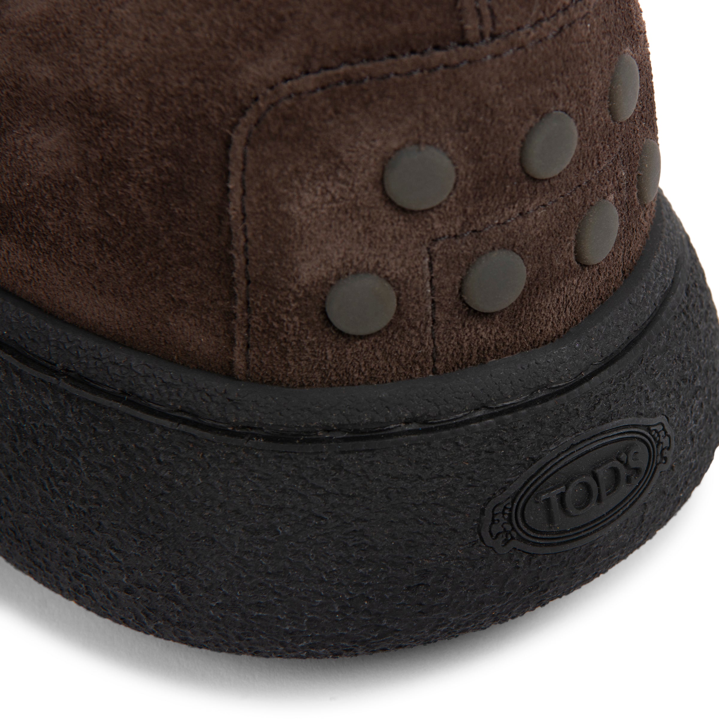 Brown and black winter boot with brand logo on a white background