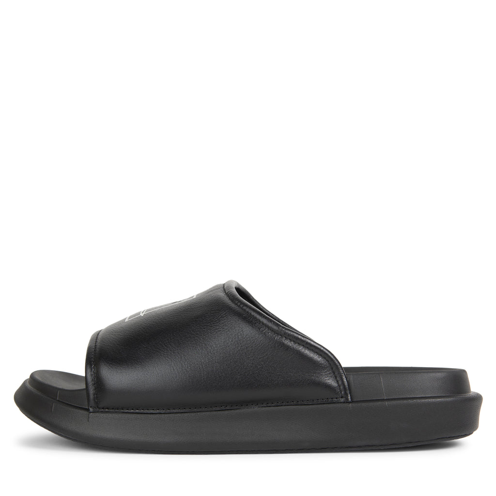 Navy blue slide sandal on a white background