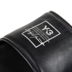 Black sandal with a logo on a white background