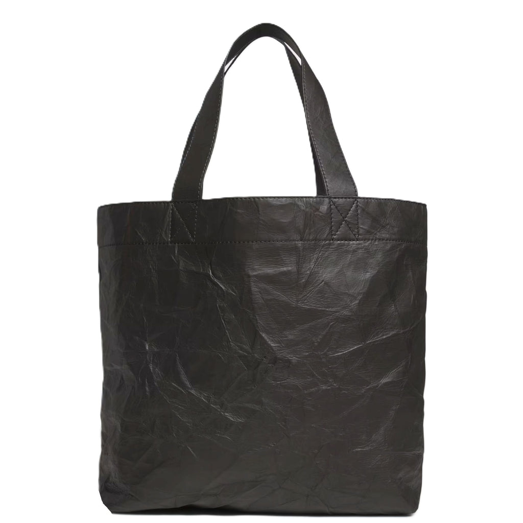 Y-3 black tote bag in crinkle leather with open-top design, structured silhouette and minimalist branding