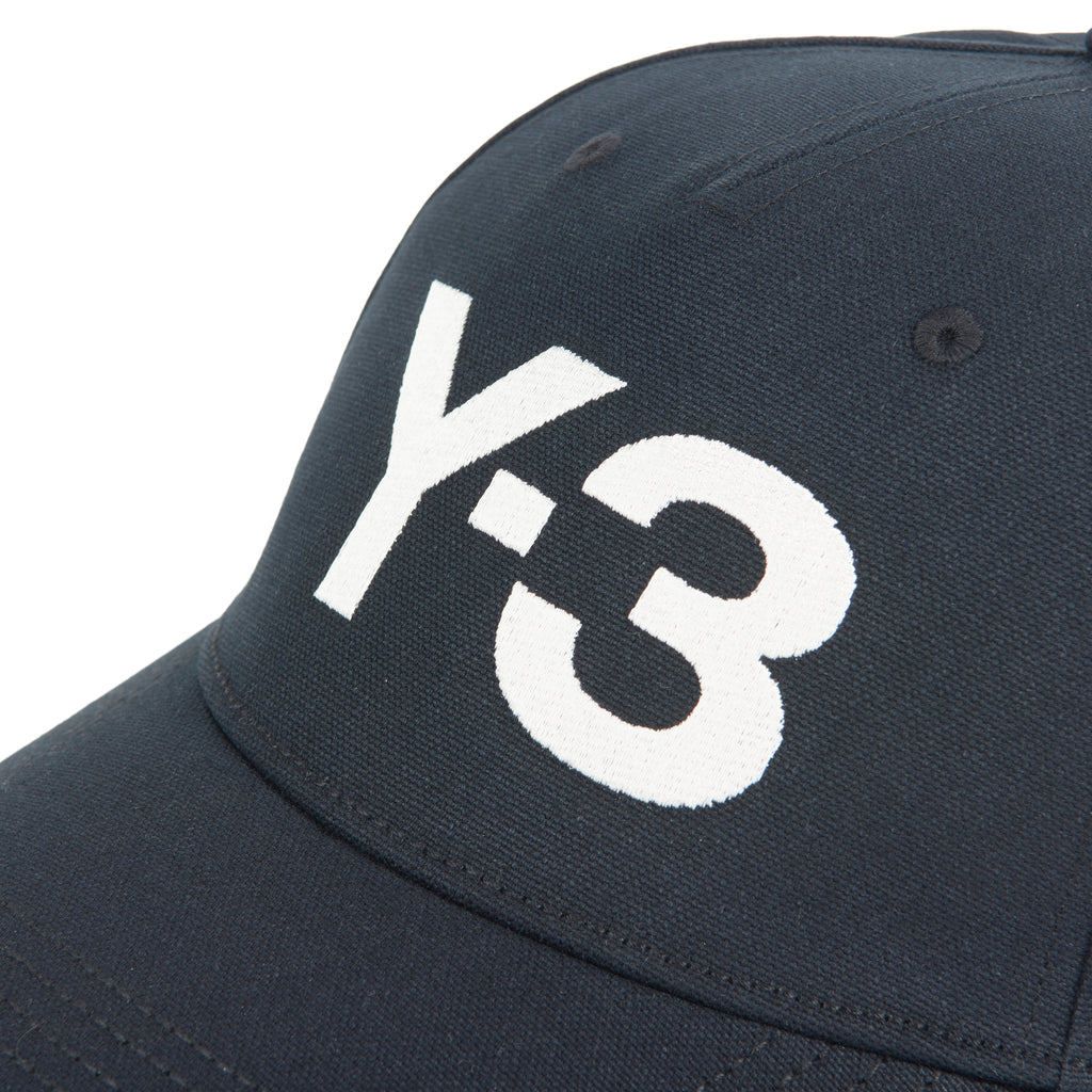 Navy blue cap with white 'Y-3' logo on a white background