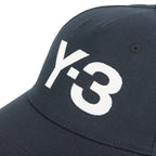Navy blue cap with white 'Y-3' logo on a white background