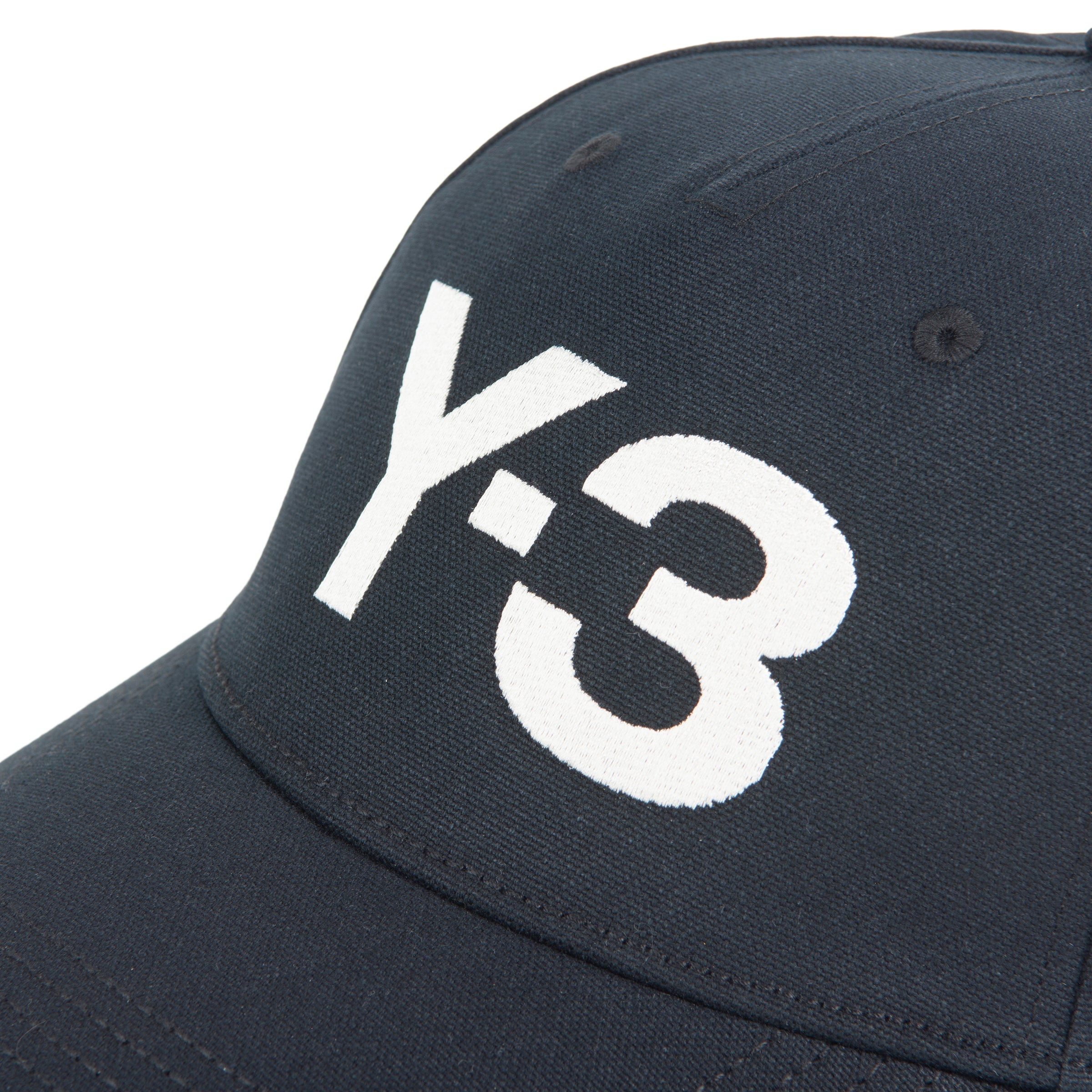 Navy blue cap with white 'Y-3' logo on a white background