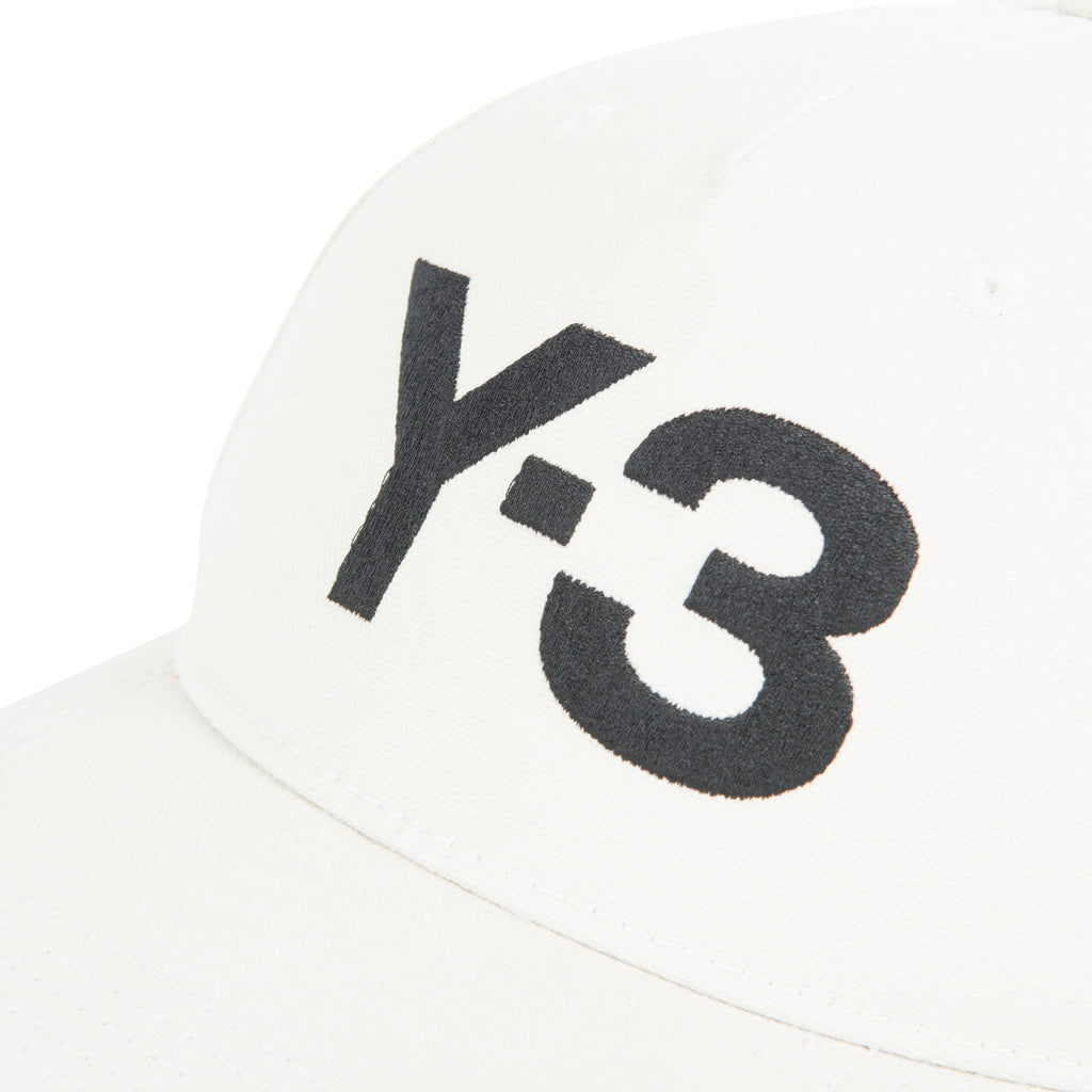 White cap with black 'Y-3' logo on a white background