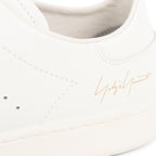 Y-3 off white Stan Smith trainers with minimalist leather upper, perforated detailing and clean low-top silhouette